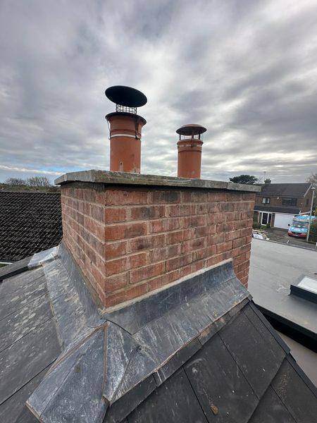 Two new pots back in, rain cap on the taller one