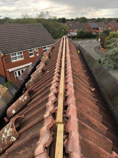 Ridge tiles lifted off and the new timber batten screwed down