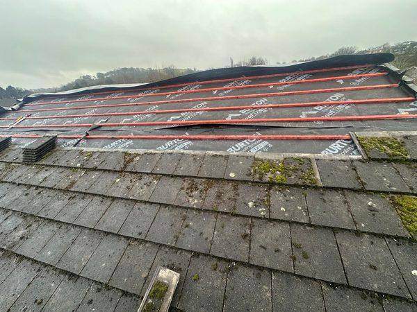 Battens run up the slope in courses, membrane lapped beneath each one