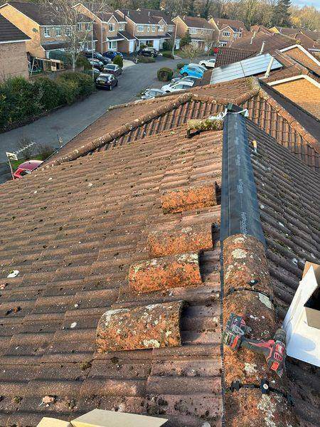 Ridge roll run out along the apex, old tiles set aside