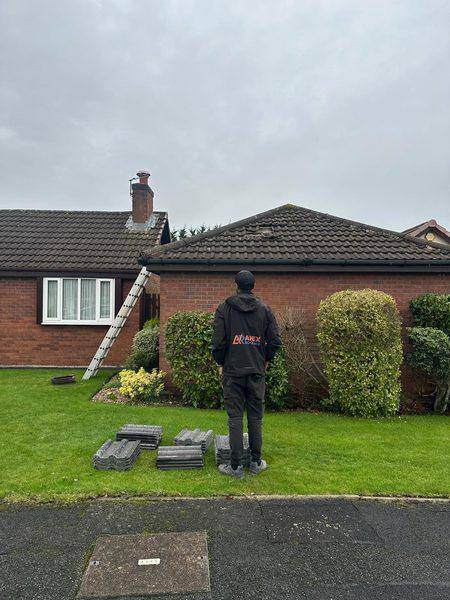 Ridge tiles set out in rows on the lawn while the bed was cleared